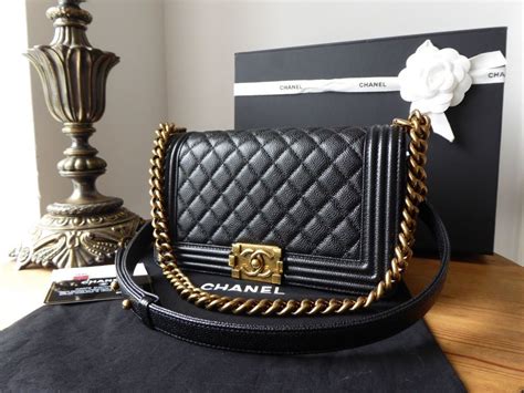 chanel boy bag black caviar gold hardware|BOY CHANEL .